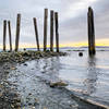 These wood pillars stand tall at the far end of Clayton Beach.