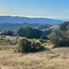 A views of the Santa Cruz Mountains and the Pacific Ocean off in the distance.