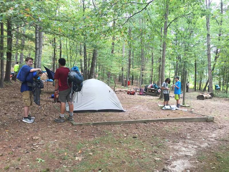 Scout troop setting up camp.