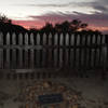Anton Knechtel (1823-1903) gravesite at sunset, enclosed by a new wood picket fence.