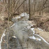 Spring Creek; partially ice-covered in the winter.