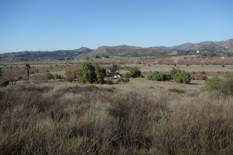 San Pasqual Valley viewed from the Raptor Ridge trail. The tethered hot air Balloon Safari at San Diego Zoo Safari Park is visible in the distance at the right edge.