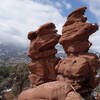 Siamese Twins rock formation at the Garden of the Gods with the Rockies in the background.