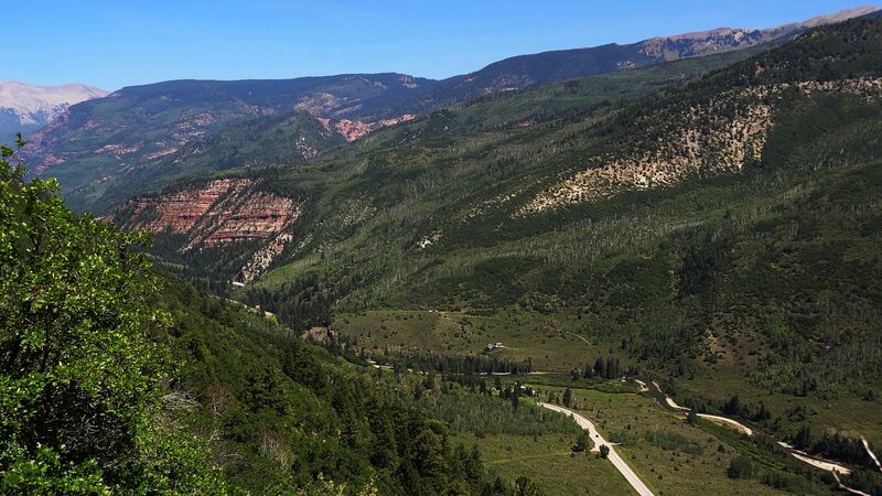 View of Crystal River Canyon towards Carbondale with trailhead at road between the two groups of trees at lower right of photo.