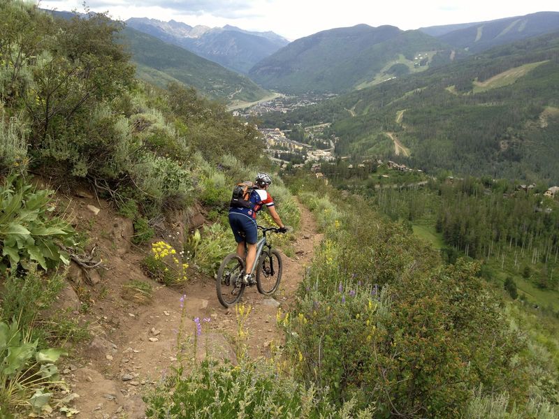 Starting the descent, with views of Vail and the Gore Range.