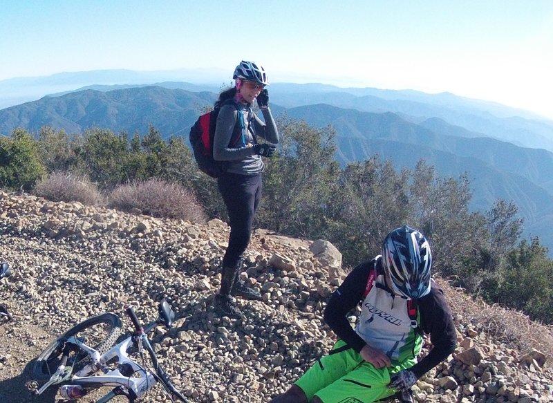 One short break before the final push to the top. Take a look around. You're so high on the pean now that sight lines open up to both sides of the mountain. You're almost there!