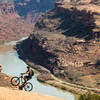 You can see the last section of the Porcupine Rim trail in the background. Wheelies are fun.