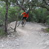 Taylor hitting the berms along the Tangle of Trails Loop