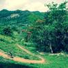 View of the Corozal MTB Trail to the mountain with a cave