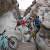Passing bikes down the granite slot canyon. It helps to have a friend!