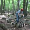 The builder riding Whiplash, a stunt on Hansen's Be-Bop. This is a good practice line for stunts further along in your ride. 2"x10" entry, drop to long 2"x6", drop to long 2"x4", then onto short on-end 2"x4". Yes, 2" wide at the end! This is a beginner/intermediate stunt with little risk involved