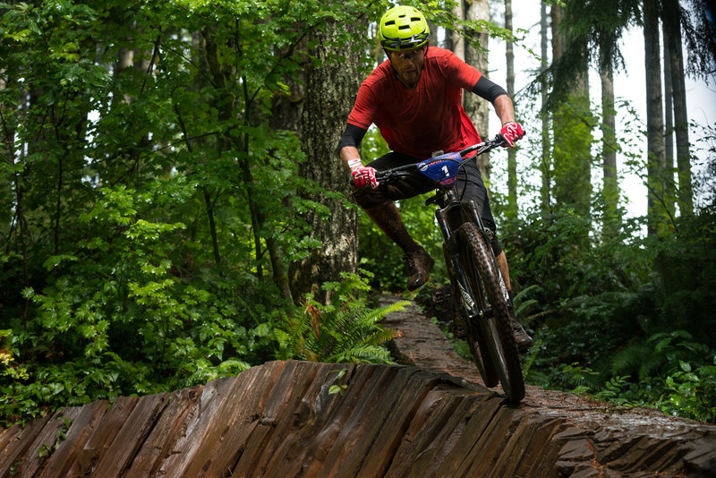 Alexander McGuinnis navigates a slippery log ride on Little Larch.