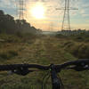Riding on the southern part of the loop, on the utility right-of-way. The woods to the left is where most of the trail is located.