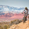 Rounding the corner on Sidewinder with the beautiful Snow Canyon and Pine Mountains in the background.