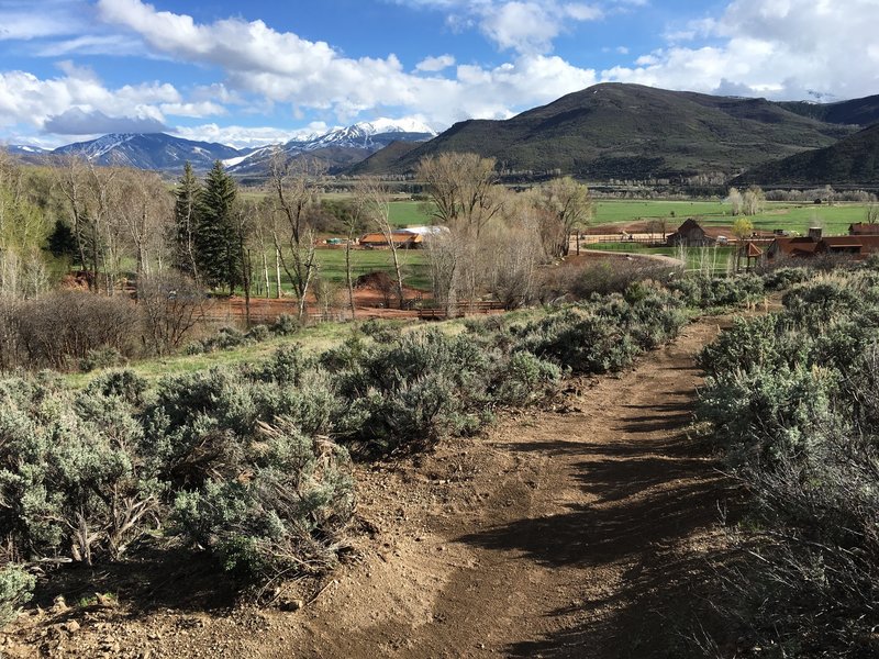 Heading back down the Red Canyon Trail. Aspen Highlands in the distance, Aspen Valley Ranch in