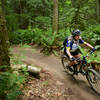 A rider enjoys the smooth berms found along Bootcamp at Duthie Bike Park, WA.
