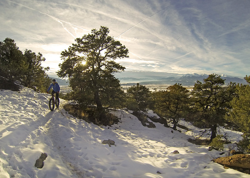The sun begins to set on an evening snow ride on North Backbone in the Arkansas Hills Trail System, Salida, CO.