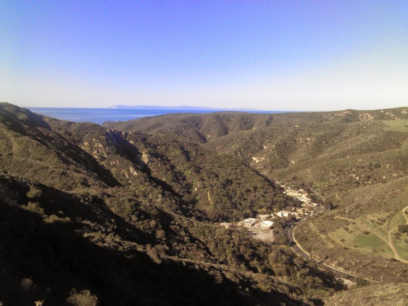 Top of Mathis by the fire hydrant overlooking Laguna Canyon Road with Catalina Island in background.