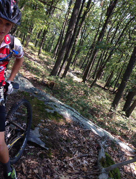 Reid realizing just how sick the rock slabs are along 6 Mile Trail.