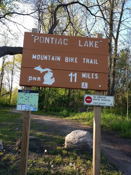 The signpost near the start of the Pontiac Lake Mountain Bike Trail. The posted mileage may be a little generous in reality.