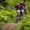 Racers pedal down a narrow ribbon of singletrack on Show-Low.