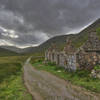 A trailside ruin offers no roof to shelter from the coming rain.