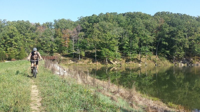 W riding along Crooked Creek Lake Dam at the end of the Crooked Creek ...