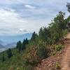 Styling out some grade reversal air-time on the upper slopes of Red Mt. on Grandstaff Trail.