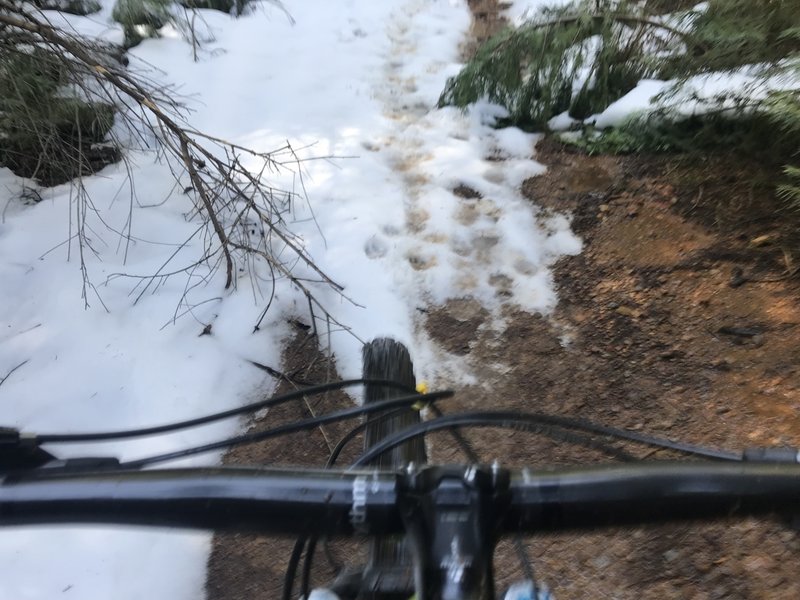 Multiple shallow snowy sections on the climb up to the top