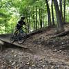 Riding the wood berm to a small drop is no problem, even if you’re 60 Plus!