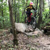 Riding one of the larger Rock pile features on this trail System!