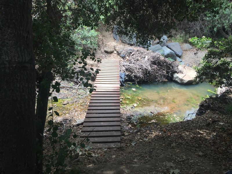 Southern bridge. South bank is very steep and likely requires a bike carry.