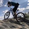 Brandon on the Slab Boulder Problem… with his bike!