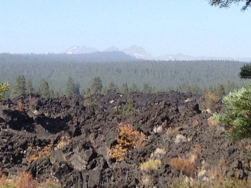 Smokey view of the Cascades, with lava flow.