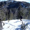 Starting down Burnt Knob. The headwaters area of Red Lodge Mountain is visible in on the slope in front of the skier.