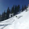 Nick finding the good stuff near the bottom of the terrain park. See that cliff to his (skier's) left? Stick close to it.