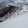 North side of the ridge above cornice bowl, facing south. Easiest descent is downhill from this location, and steeper descents can be found as you approach the cornice