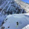 Dropping into Grizzly Couloir after traversing under the cornice.